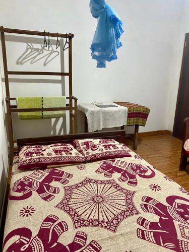a bed with two pillows on it in a room at Fly-In Stay Katunayake in Katunayaka