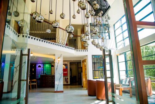 a lobby with a chandelier in a building at Lavendish Beach Resort in Unawatuna