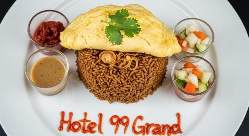 a plate of food with rice and vegetables on it at Ninety Nine Grand Hotel in Badulla