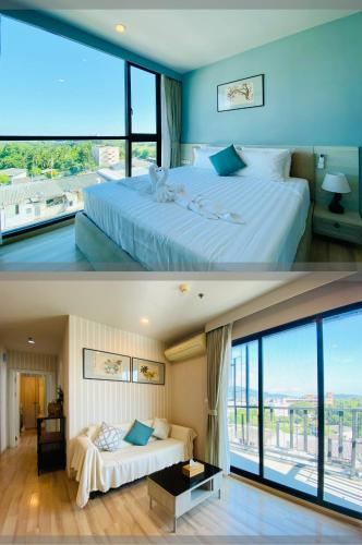 a bedroom with a large bed and a large window at The Base Height Condo with Rooftop infinity pool in Ban Sam Kong