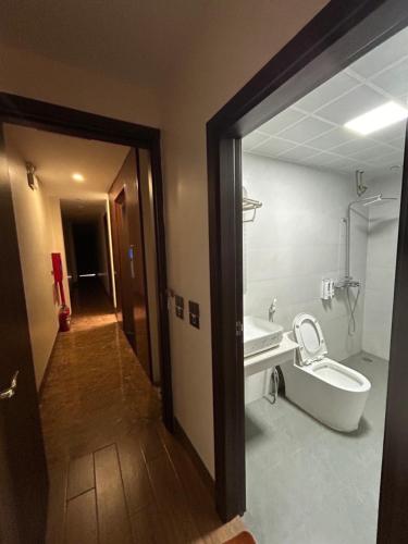 a bathroom with a tub and a sink and a toilet at OnTop Hotel in Sapa