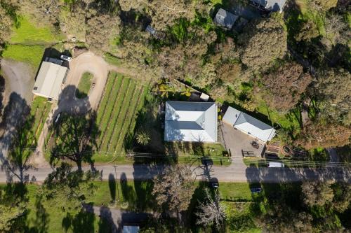 an aerial view of a house on a hill at McLaren Flat Studio in McLaren Flat