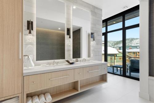 a bathroom with a sink and a mirror at Hyatt Centric Park City in Park City