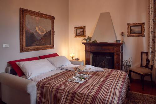 a bedroom with a bed with a table on it at Le Balze Appartamenti in Perugia