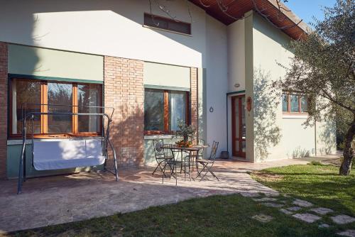a patio of a house with a table and chairs at Le Balze Appartamenti in Perugia