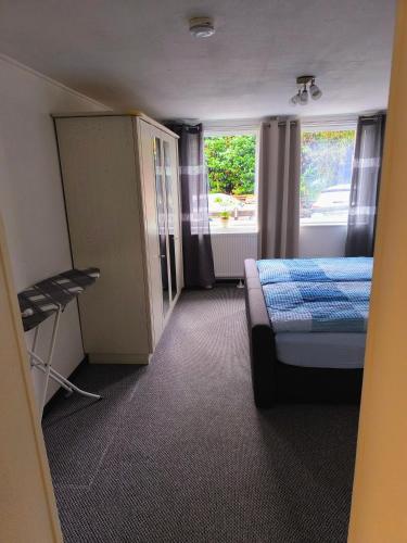 a small room with a bed and a window at Ferienwohnung Viktoria in Ehrlich