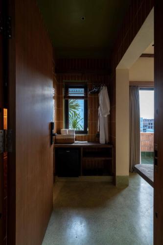 a bathroom with a sink and a window at Olwen Boutique Hotel in Danang