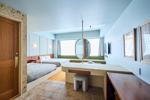 a bathroom with a sink and a bed in a room at Hotel Vintage Tokyo Meguro Fudomae in Tokyo