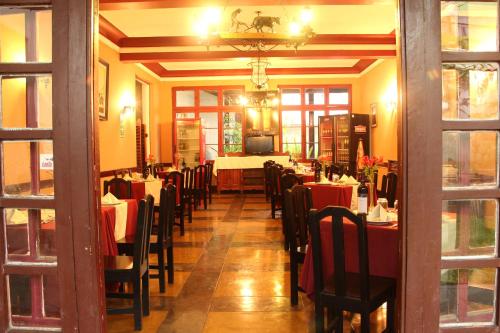 a dining room with tables and chairs in a restaurant at Hotel de Turistas Abancay in Abancay