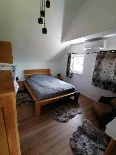 a bedroom with a large bed in a room at Danube Escape with Jacuzzi, Pool & Spacious Yard by Destination GREEN Croatia in Bogaljevci