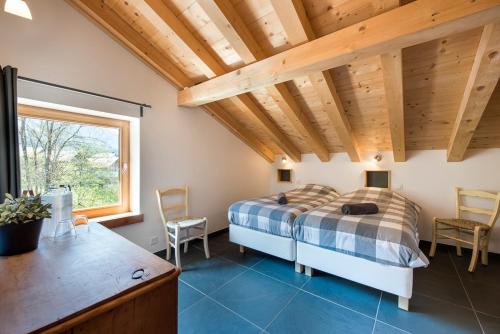 a bedroom with a bed and a wooden ceiling at Ski and bike - holiday home Verbier Valley in Versegeres 