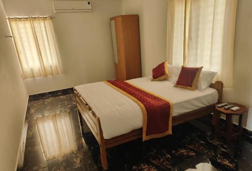 a bedroom with a bed in a room that is covered in debris at Thulir Farm Stay Near Isha Yoga Adiyogi in Coimbatore