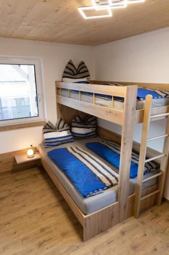 a bunk bed room with two bunk beds in it at Huawa Appartements in Öblarn