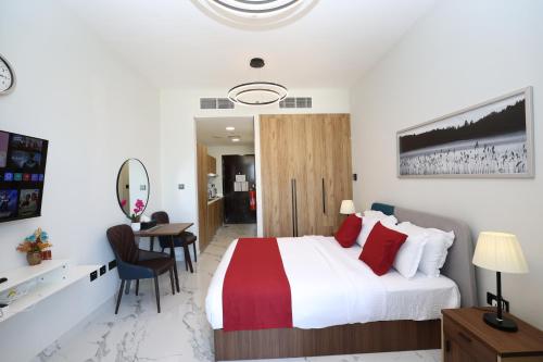 a hotel room with a bed and a desk at Al Maryah Studio near Cleveland and Galleria Mall by Central Stay in Abu Dhabi