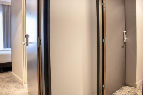 a pair of elevators in a hotel room at Brit Hotel Cahors Centre - Le Valentre in Cahors