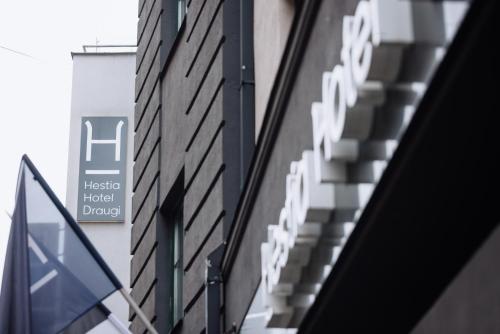 a sign for the hilti hotel dallas at Hestia Hotel Draugi in Riga