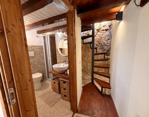 a bathroom with a ladder leading to a bathroom with a sink at IL COLLE Holiday Home - FIUGGI - Charming independent home in the historic center, near the Thermal Baths & Wellness Retreats in Fiuggi
