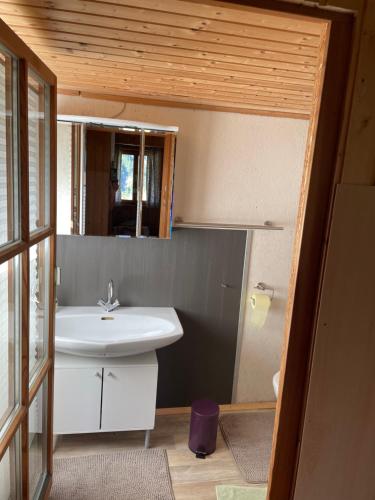 a bathroom with a sink and a mirror at Chalet Valuga in Kaisers