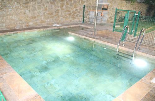 a large swimming pool with blue water at Chalet El Palmar in El Palmar