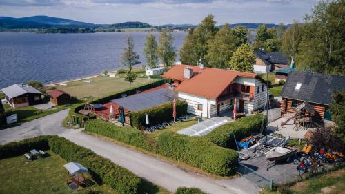 an aerial view of a house next to the water at Penzion Rak Wellness in Černá v Pošumaví