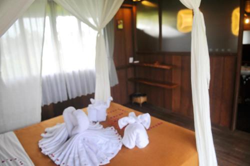 Un ou plusieurs lits dans un hébergement de l'établissement Taman Bintang Villa Ubud