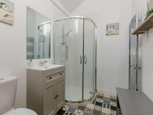 a bathroom with a shower and a toilet and a sink at 2 Bed in Umberleigh oc-09089 in Umberleigh Bridge