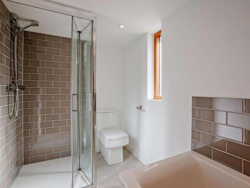 a bathroom with a shower and a toilet at 2 Bed in Kings Nympton oc-87985 in Kings Nympton