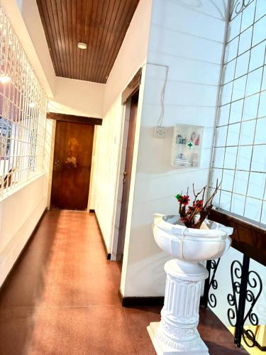a bathroom with a toilet in the middle of a hallway at Heritage Villa colombo7 in Colombo