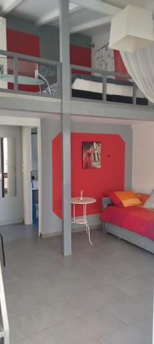 a bedroom with a bunk bed and a table at Irida's House in Xylokastro