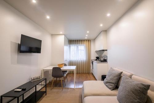 a living room with a couch and a table at Terro Collection - Eça de Queirós in Braga