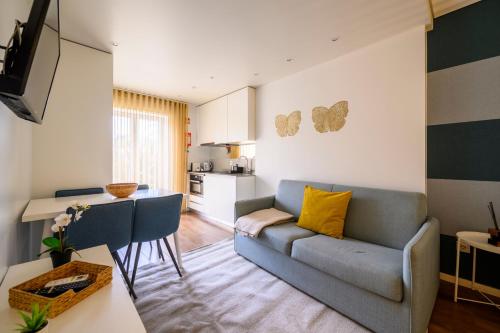a living room with a couch and a table at Terro Collection - Eça de Queirós in Braga