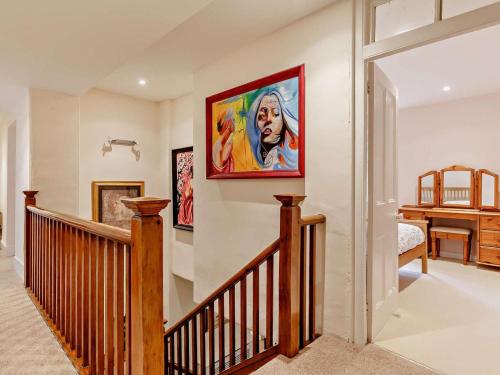 a staircase in a home with a painting on the wall at 4 Bed in Tavistock oc-92491 in Bulkworthy