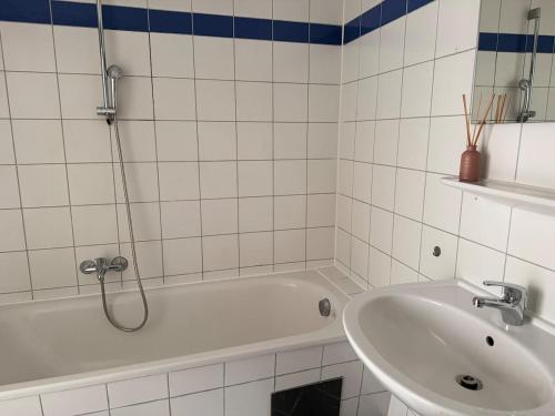 a bathroom with a bath tub and a sink at Faraway Homes Studio Mautern #8 in Mautern in Steiermark