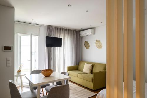 a living room with a couch and a table at Terro Collection - Eça de Queirós in Braga