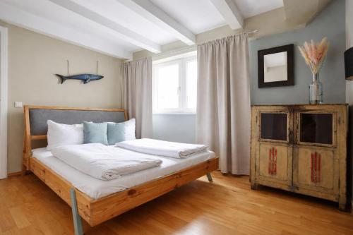 a bedroom with a bed with a fish on the wall at Design Apartments - "Potsdam City" , 19 in Potsdam