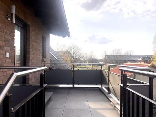 a balcony with a view of a building at FeWo Wolfsbau ID 16290-9 in Kargow