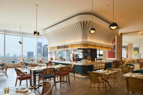 an image of a restaurant with tables and chairs at Centara Grand At CentralWorld in Bangkok