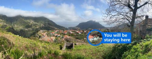 a sign that says you will be staying here on a mountain at Casa Levada Explorer - Cozy Nights & Easy Meals in Santana