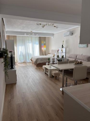 a living room with a couch and a table at Isabella in Roquetas de Mar