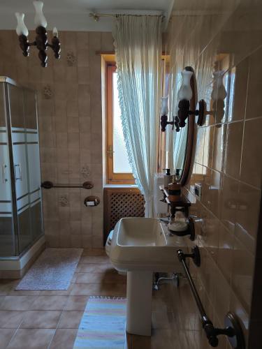 a bathroom with a sink and a shower at Casa Filadelfia in Turin
