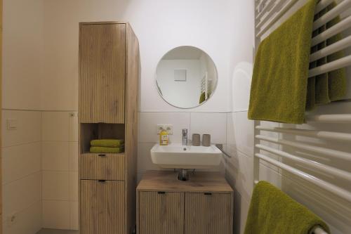a bathroom with a sink and a mirror at Bachbauer am Attersee in Weyregg
