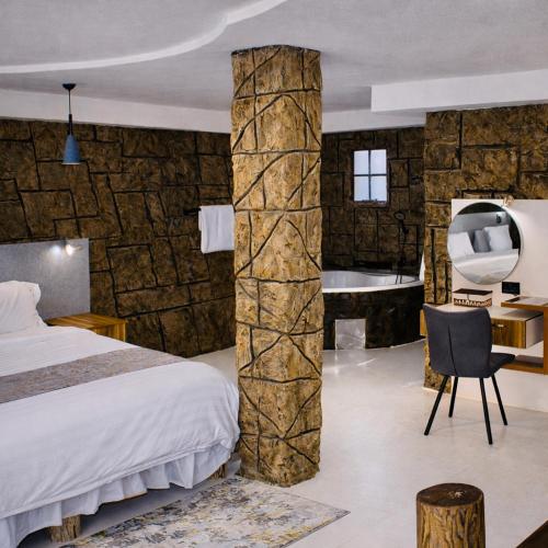 Postel nebo postele na pokoji v ubytování Rustiek Hotel