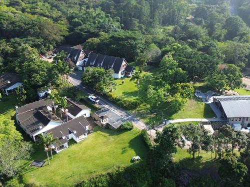 an aerial view of a house with a yard at Bellevue Guest Lodge in Southbroom