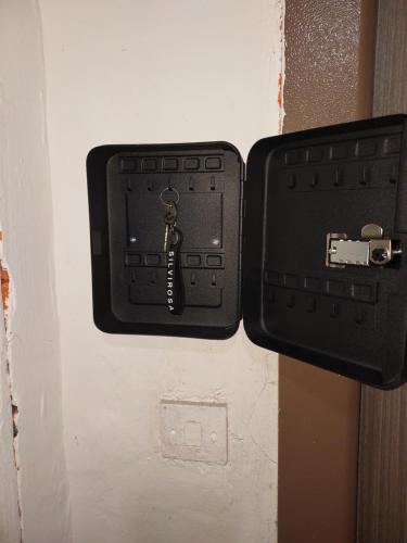 a black box with a key on a wall at Amy&Domy in Iscroni