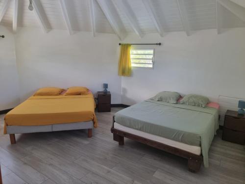 Llit o llits en una habitació de Éden Évasion