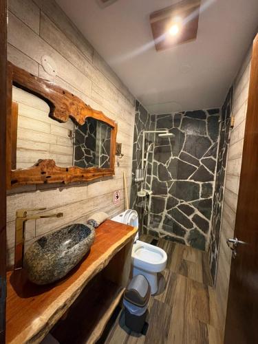 a bathroom with a sink and a toilet at Casa Nuna in Tilcara