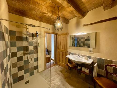 a bathroom with a sink and a shower at La Blu di Via Silvano 8 in Monforte dʼAlba
