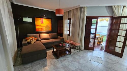 a living room with a couch and a table at Casona El Rosedal in Bell Ville