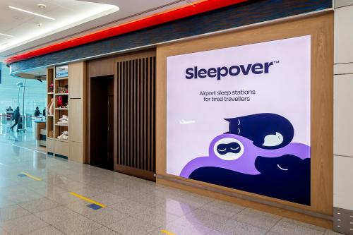 a sign for a sleepover in a shopping mall at Sleepover Terminal 3, Concourse A - formerly sleep 'n fly in Dubai