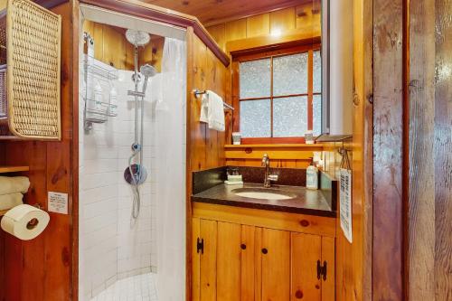 a bathroom with a sink and a shower at Eagle Beach Retreat in Freeland